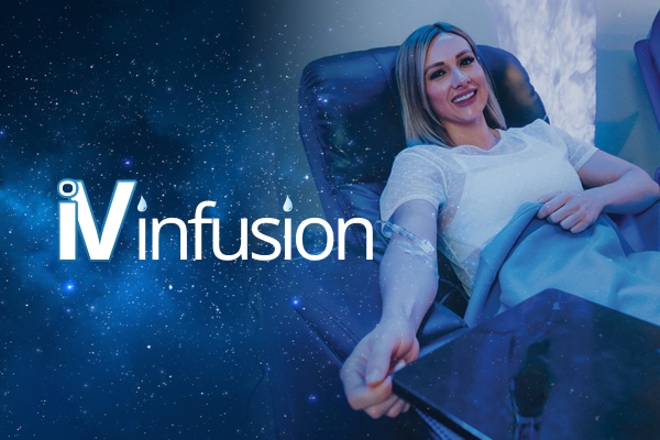 A smiling woman sits in a blue recliner